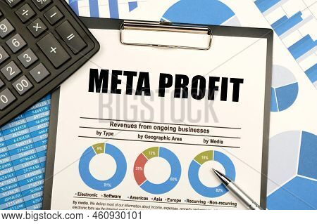 Business Concept. Against The Background Of Charts And Graphs, There Are Office Items And A Tablet W