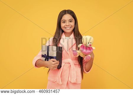Good Morning. Kid Wear Soft Nightsuit Play With Toy. Child In Cozy Sleepwear. Skin Beauty.