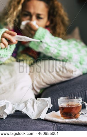 Seasonal Cold Illness Concept With Adult Woman Checking Fever And Drinking Hoth Ealthy Tea At Home L