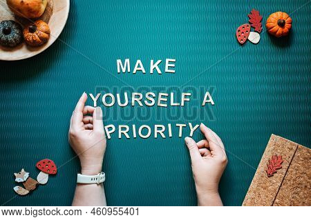 Self-care Quotes, Make Yourself A Priority Words And Female Hands On Green Background Flat Lay. Self