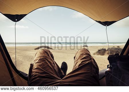 Alternative Vacation Concept With Man In Trekking Clothes Laying Outside The Tent Campiing Free At T