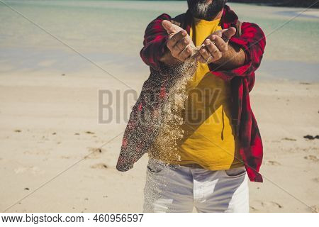 Close U View Of Unrecognizable Caucasian Tourist Man Playing With The Sand At The Beach Durint Tropi