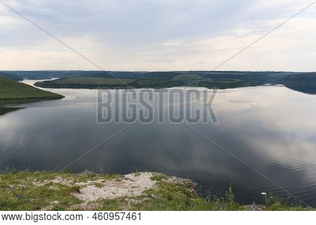 The Banks Of A Large River. A Calm Smooth Water View. The Landscape Of Bakota Bay On The Dniester Ri