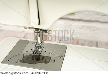 Close-up Part Of Sewing Machine, Presser Food And Needle. Workng Part Of Modern Sewing Machine. Sewi