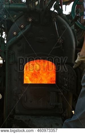 A View Of The Hot Flames Inside A Firebox Of A Steam Engine Tractor