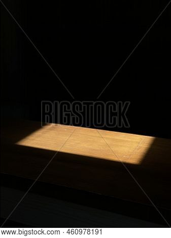 The Lightest Rectangle In The Dark At The Table
