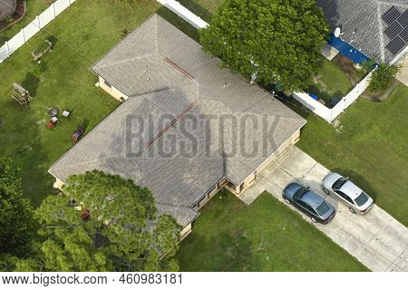 Aerial View Of Typical Contemporary American Private House With Roof Top Covered With Asphalt Shingl