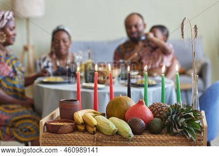 Close-up Of Traditional Decoration With Candles And Exotic Fruits For Kwanzaa Celebration With Famil