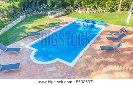 Summer Pool In The Courtyard Near The House. Sunbeds For Relaxing.