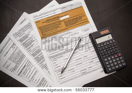 Polish Tax Form With Pen And Calculator On Desk