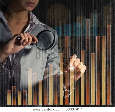 business woman draws a graph