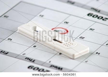 Pregnancy Test And A Circled Date - Close Up