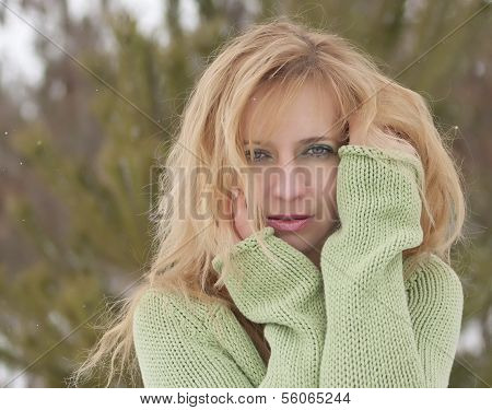 Outdoor fashion portrait of pretty young woman in winter