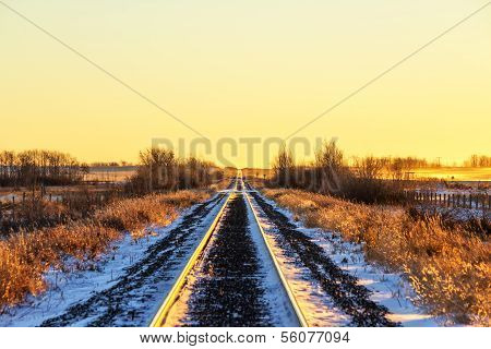 Sunrise over a rural railroad track