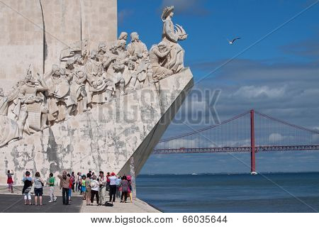 LISBON, PORTUGAL - MAY 28, 2014: Tourist visiting the Monument to the Discoveries in Lisbon. The monument celebrates the Portuguese Age of Discovery during the 15th and 16th centuries.