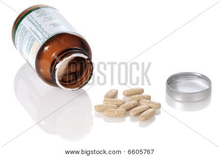Open Bottle And Vitamins