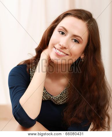 Young woman lying on bed .