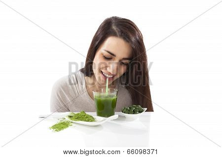Beautiful Girl Drinking Green Juice.