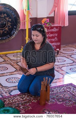 Bangkok, Thailand - January 1 : Unidentified Woman Shake A Chi-chi Sticks For Predicton
