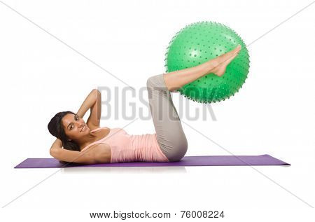 Young woman exercising with swiss ball