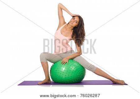 Young woman exercising with swiss ball