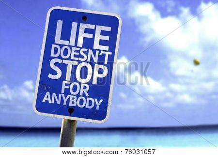 Life Doesn't Stop for Anybody sign with a beach on background