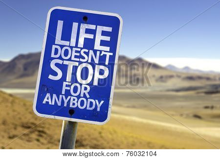 Life Doesn't Stop for Anybody sign with a desert background