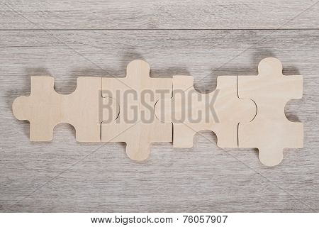 Wooden Jigsaw Pieces On Table