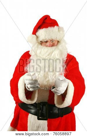 Santa in Hand Cuffs. Santa Claus has been a Bad Bad Boy this year. Perhaps he had one to many Brandy Alexander's or Too Many Cookies or went down the chimney of an Unbeliever and they called the cops.