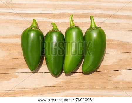 Chile Jalapeno hot chili pepper on wood background