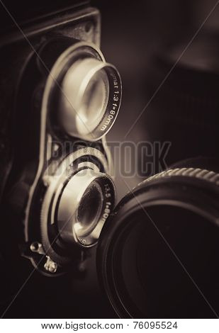 Vintage camera and lenses toned in sepia