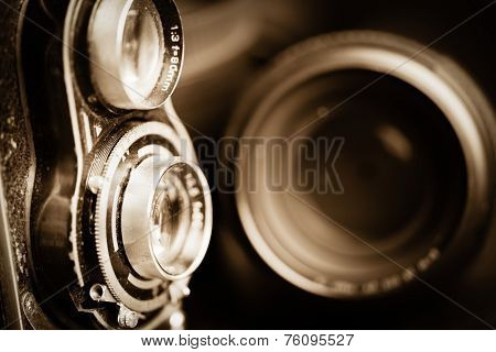 Vintage camera and lenses toned in sepia