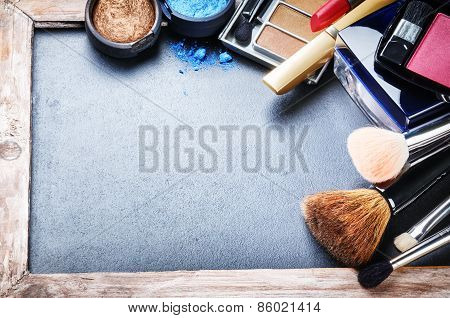 Various Makeup Products On Dark Background