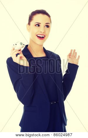 Young businesswoman with plane toy in hand
