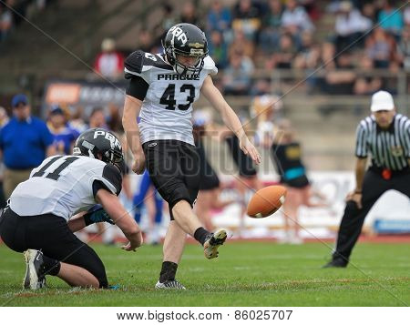 GRAZ, AUSTRIA - APRIL 04, 2014: K Marek Hrubon (#43 Panthers) kicks the ball in an AFL football game.