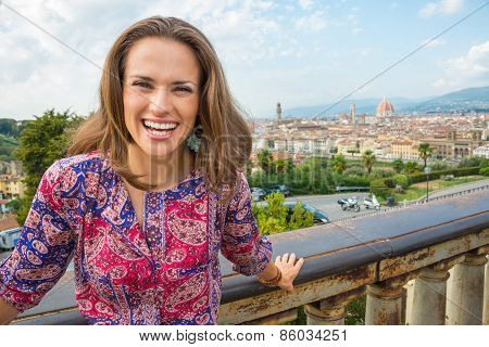 Portrait Of Smiling Young Woman Against Panoramic View Of Floren