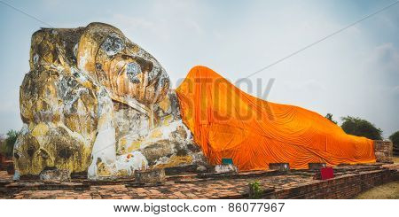 Giant Reclining Buddha in Wat Lokayasutharam. Ayutthaya historical park. Panorama