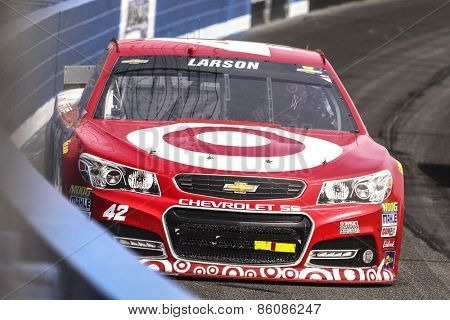 Fontana, CA - Mar 22, 2015:  Kyle Larson (42) brings his race car through the turns during the  race at the Auto Club Speedway in Fontana, CA.