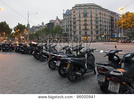 BARCELONA SPAIN - 9 MAY 2010: Motorcycles parked on the city street 9 May 2010 in Barcelona Spain