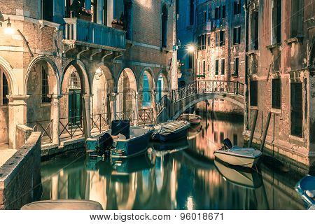 Night lateral canal and bridge in Venice, Italy