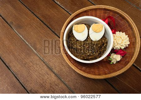 Thai Food Pound Eggplant With Boiled Egg On Wood Table