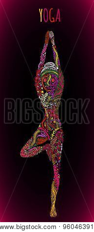 female silhouette practicing yoga pose.design with ornate flower