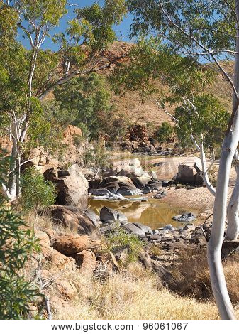 Water hole along the rim walk in the dry Ormiston Pound