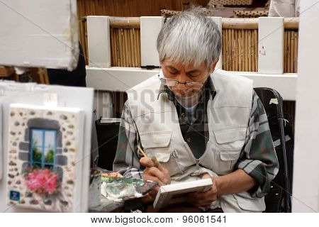 Paris, France - August 19, 2014. Artists Easels And Artwork Set Up In Place Du Tertre In Montmartre.