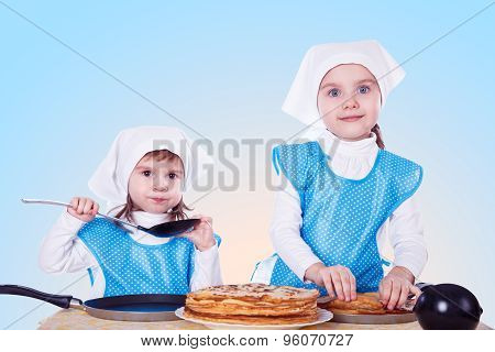 Little Children With Pancakes. Two Cute Girls Playing As Chefs. Surprise For Mothers Day. Blue Backg