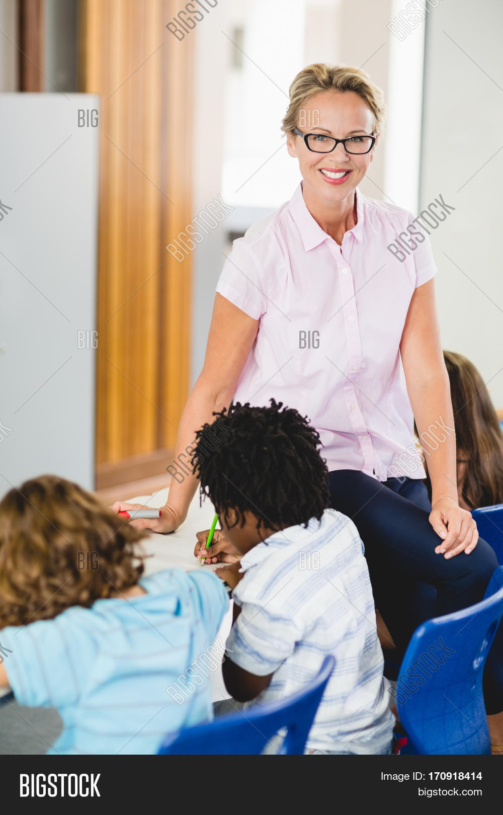 Teacher Helping Kids Image & Photo (Free Trial) | Bigstock