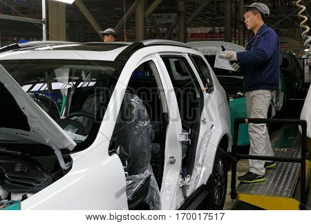 Tianjin, China. December 17Th 2016: Workers Assemble A Car On Assembly Line In Car Factory