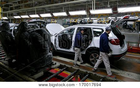 Tianjin, China. December 17Th 2016: Workers Assemble A Car On Assembly Line In Car Factory