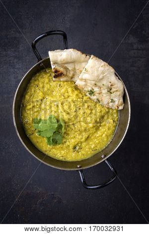 Indian Dal Soup with Naan Bread in Bowl
