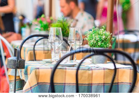 Summer empty outdoor cafe at tourist european city